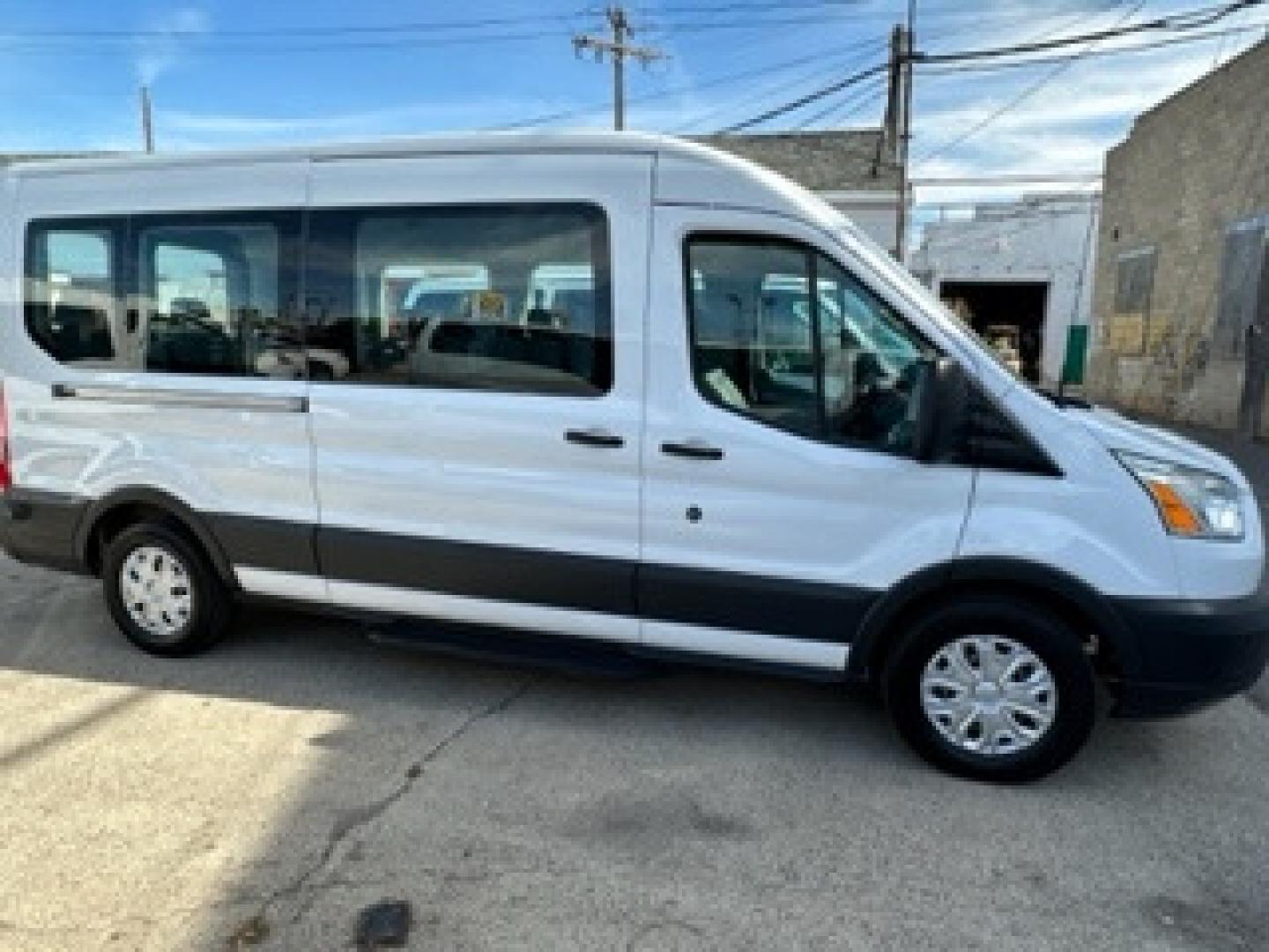 2016 White /Gray Ford Transit 350 Wagon Med. Roof XLT w/Sliding Pass. 148-in. WB (1FBAX2CG3GK) with an 3.5L V6 DOHC 24V engine, 6A transmission, located at 3200 1st Avenue North, Billings, MT, 59101, (406) 245-9055, 45.779270, -108.510742 - FRESH OFF-LEASED AND WELL MAINTAINED! 15 Passenger with Tow Package, Power Windows, Power Door Locks, Passenger Side Running Board, Tilt Steering, Rear A/C and Heat and Much More. CarFax Dealer Auto Brokers of Montana/AA&A Auto Rental/Fox Car Rental in Billings - Photo#3