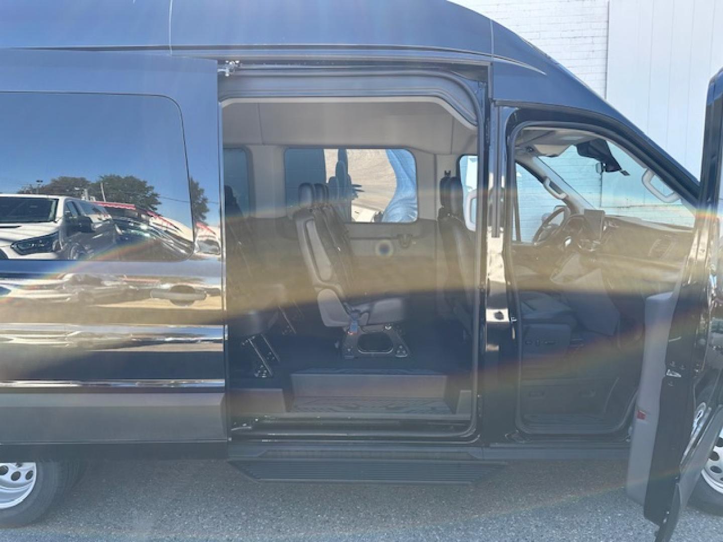 2023 Agate Black Metallic /Ebony Leather Ford Transit 350 Wagon HD High Roof XLT Sliding Pass. 148 WB EL (1FBVU5XG4PK) with an 3.5L V6 DOHC 24V engine, 6A transmission, located at 3200 1st Avenue North, Billings, MT, 59101, (406) 245-9055, 45.779270, -108.510742 - Luxury All Wheel Drive 'Limo' with Less Than 6,000 Miles. 3.5L EcoBoost Engine, Dual Power Seats, Leather Interior, High Roof, Dually Wheels, All Wheel Drive, Blind Spot Assist, Pre-Collision Assist, Heavy Duty Front Axle, Cruise Control, Tit Steering Column, Upfitter Package, Front/Rear Air Conditi - Photo#14