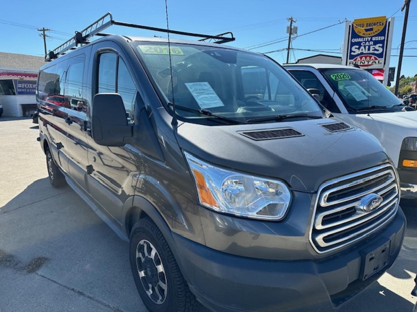 2016 Gray Ford Transit 150 Van Low Roof 60/40 Pass. 148-in. WB (1FTYE9ZM9GK) with an 3.7L V6 DOHC 24V engine, 6A transmission, located at 3200 1st Avenue North, Billings, MT, 59101, (406) 245-9055, 45.779270, -108.510742 - Local Trade-In with a Lot of Extras! Bulkhead, Air Conditioning, Automatic Transmission, Power Windows, Power Door Locks, Roof Equipment Rack, Tilt Steering Column, Tow Package, Wheels, Cruise Control, 148" Wheel Base and Great Price! CarFax Dealer. Auto Brokers of Montana/AA&A Auto Rental/Fox Ca - Photo#1