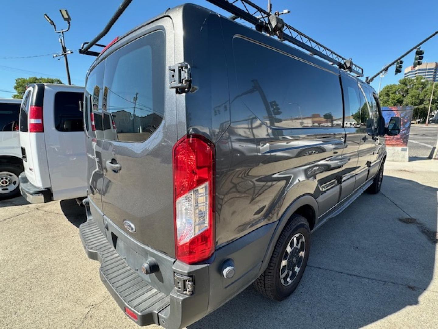 2016 Gray Ford Transit 150 Van Low Roof 60/40 Pass. 148-in. WB (1FTYE9ZM9GK) with an 3.7L V6 DOHC 24V engine, 6A transmission, located at 3200 1st Avenue North, Billings, MT, 59101, (406) 245-9055, 45.779270, -108.510742 - Local Trade-In with a Lot of Extras! Bulkhead, Air Conditioning, Automatic Transmission, Power Windows, Power Door Locks, Roof Equipment Rack, Tilt Steering Column, Tow Package, Wheels, Cruise Control, 148" Wheel Base and Great Price! CarFax Dealer. Auto Brokers of Montana/AA&A Auto Rental/Fox Ca - Photo#3