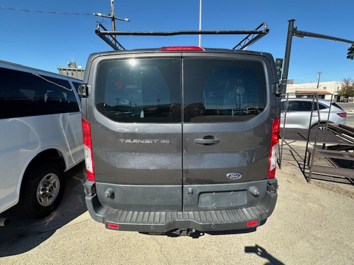 2016 Gray Ford Transit 150 Van Low Roof 60/40 Pass. 148-in. WB (1FTYE9ZM9GK) with an 3.7L V6 DOHC 24V engine, 6A transmission, located at 3200 1st Avenue North, Billings, MT, 59101, (406) 245-9055, 45.779270, -108.510742 - Local Trade-In with a Lot of Extras! Bulkhead, Air Conditioning, Automatic Transmission, Power Windows, Power Door Locks, Roof Equipment Rack, Tilt Steering Column, Tow Package, Wheels, Cruise Control, 148" Wheel Base and Great Price! CarFax Dealer. Auto Brokers of Montana/AA&A Auto Rental/Fox Ca - Photo#5