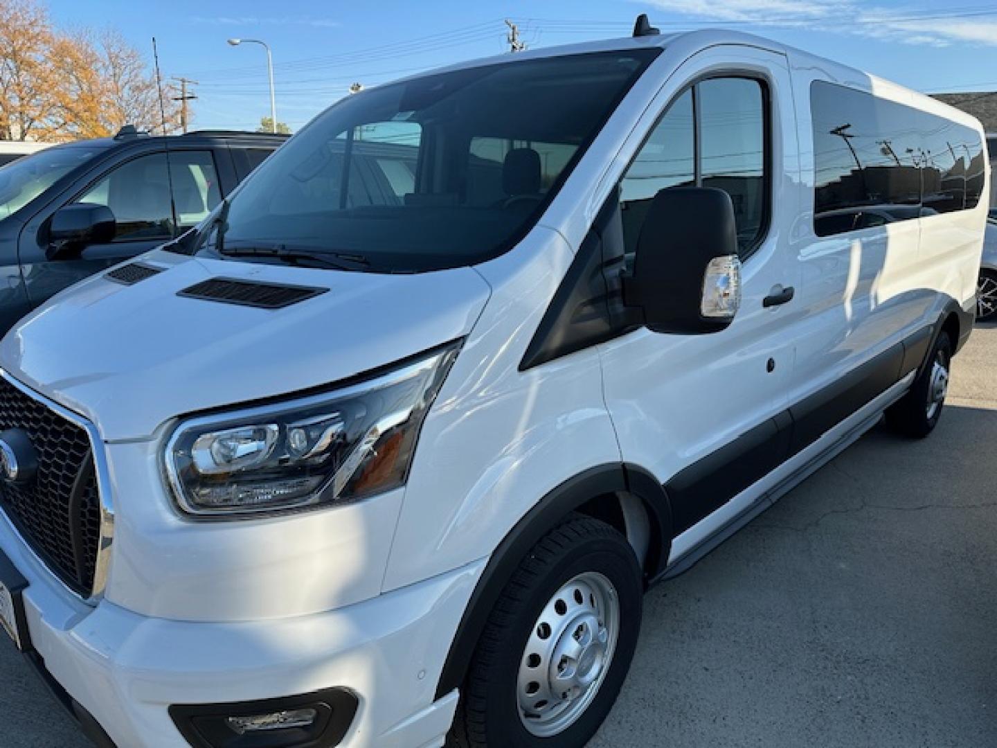 2023 White /Gray Ford Transit 350 Wagon Low Roof XL w/Sliding Pass. 148-in. WB (1FBAX9Y80PK) with an 3.5L V6 DOHC 24V engine, 6A transmission, located at 3200 1st Avenue North, Billings, MT, 59101, (406) 245-9055, 45.779270, -108.510742 - One of Our Lease Vehicles Available for Purchase or Rent. One Owner with Dual Power Front Seats, Cold Climate Control Package, Extended Range Fuel Tank Capacity, Factory Towing, Large Screen Display, Front and Rear Air Conditioning and Heat, Factory Privacy Glass and Less than 16,000 Miles! CarFax D - Photo#2