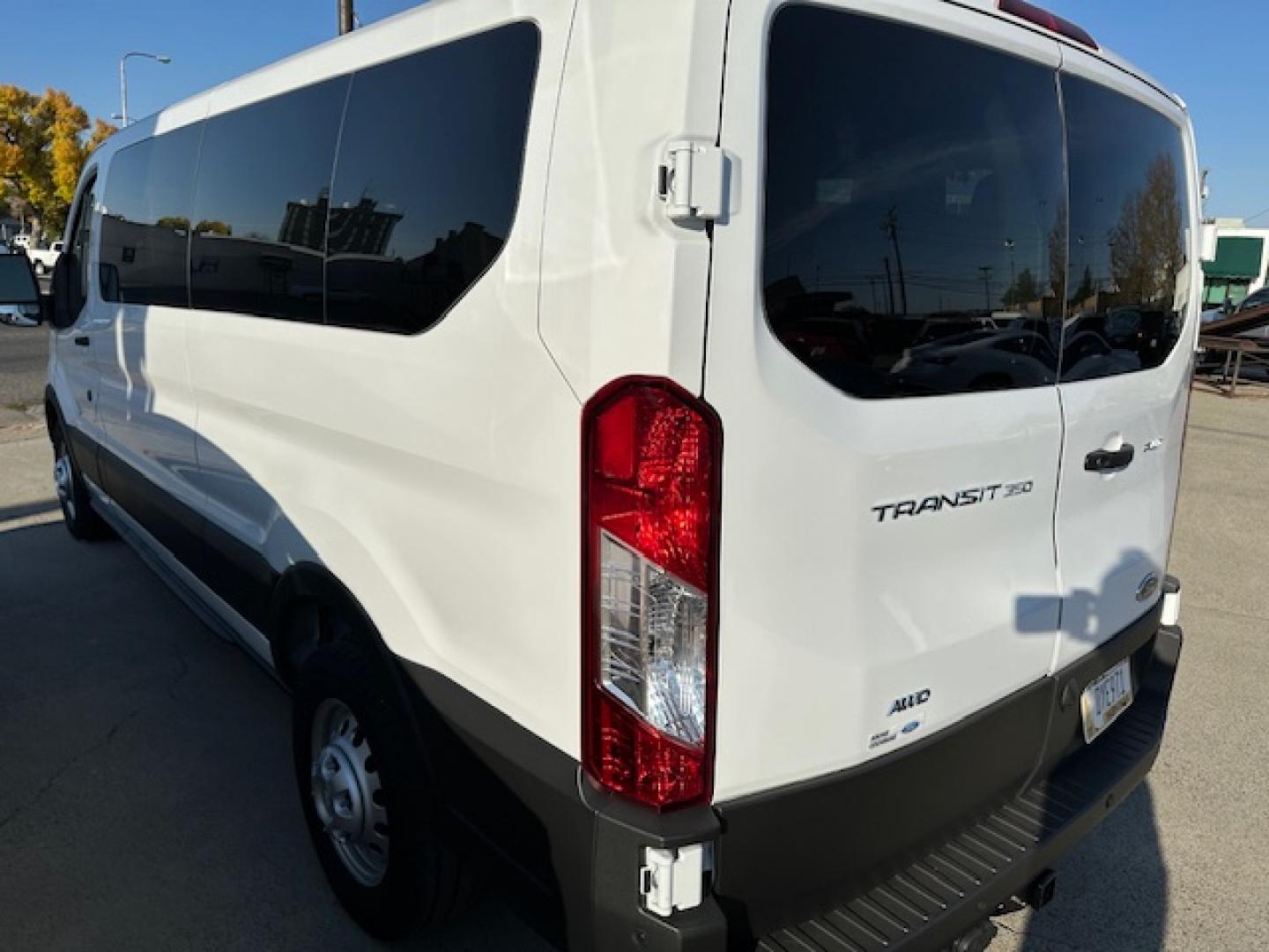 2023 White /Gray Ford Transit 350 Wagon Low Roof XL w/Sliding Pass. 148-in. WB (1FBAX9Y80PK) with an 3.5L V6 DOHC 24V engine, 6A transmission, located at 3200 1st Avenue North, Billings, MT, 59101, (406) 245-9055, 45.779270, -108.510742 - One of Our Lease Vehicles Available for Purchase or Rent. One Owner with Dual Power Front Seats, Cold Climate Control Package, Extended Range Fuel Tank Capacity, Factory Towing, Large Screen Display, Front and Rear Air Conditioning and Heat, Factory Privacy Glass and Less than 16,000 Miles! CarFax D - Photo#9