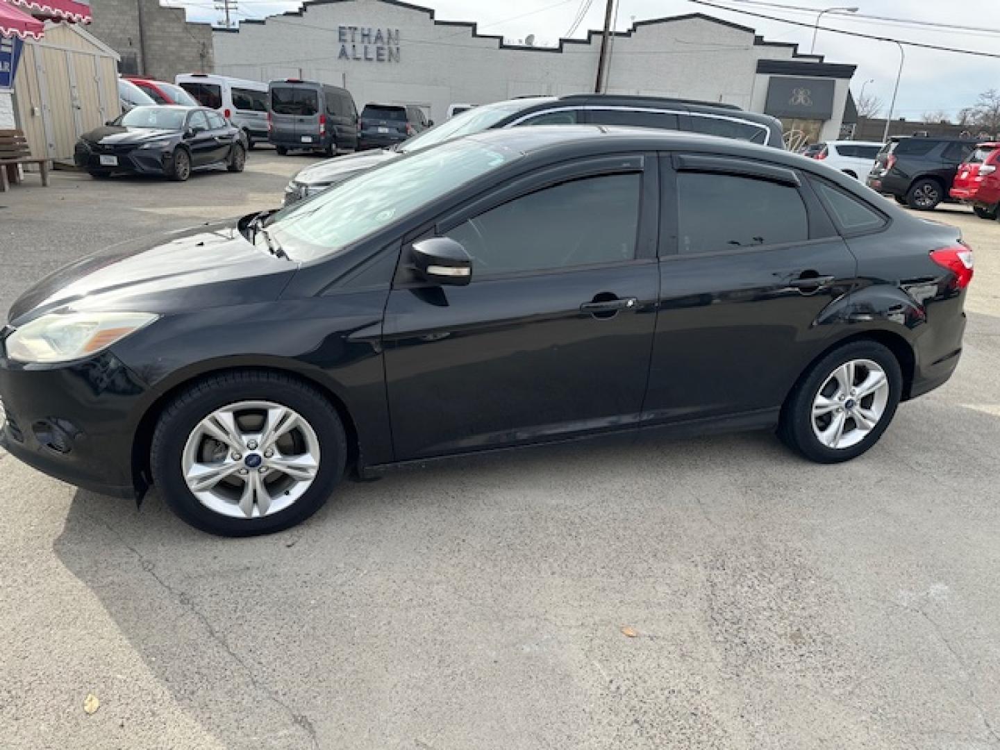 2013 Black /Gray Ford Focus SE Sedan (1FADP3F23DL) with an 2.0L L4 DOHC 16V engine, located at 3200 1st Avenue North, Billings, MT, 59101, (406) 245-9055, 45.779270, -108.510742 - Very nice Local Trade-In with Good Mileage and Great Price! Power Windows, Power Door Locks, Keyless Remote Entry, Air Conditioning, Tilt Steering Column, Cruise Speed Control, Automatic Transmission, Alloy Wheels and More. CarFax Dealer. Auto Brokers of Montana/AA&A Auto Rental/Fox Car Rental B - Photo#0