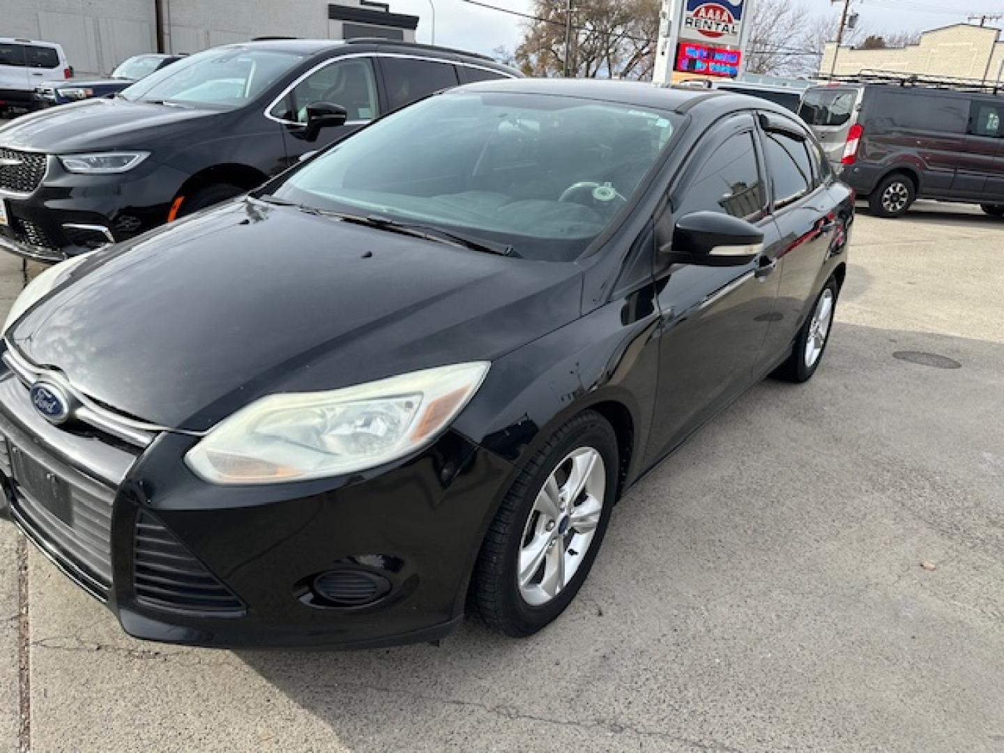 2013 Black /Gray Ford Focus SE Sedan (1FADP3F23DL) with an 2.0L L4 DOHC 16V engine, located at 3200 1st Avenue North, Billings, MT, 59101, (406) 245-9055, 45.779270, -108.510742 - Very nice Local Trade-In with Good Mileage and Great Price! Power Windows, Power Door Locks, Keyless Remote Entry, Air Conditioning, Tilt Steering Column, Cruise Speed Control, Automatic Transmission, Alloy Wheels and More. CarFax Dealer. Auto Brokers of Montana/AA&A Auto Rental/Fox Car Rental B - Photo#2