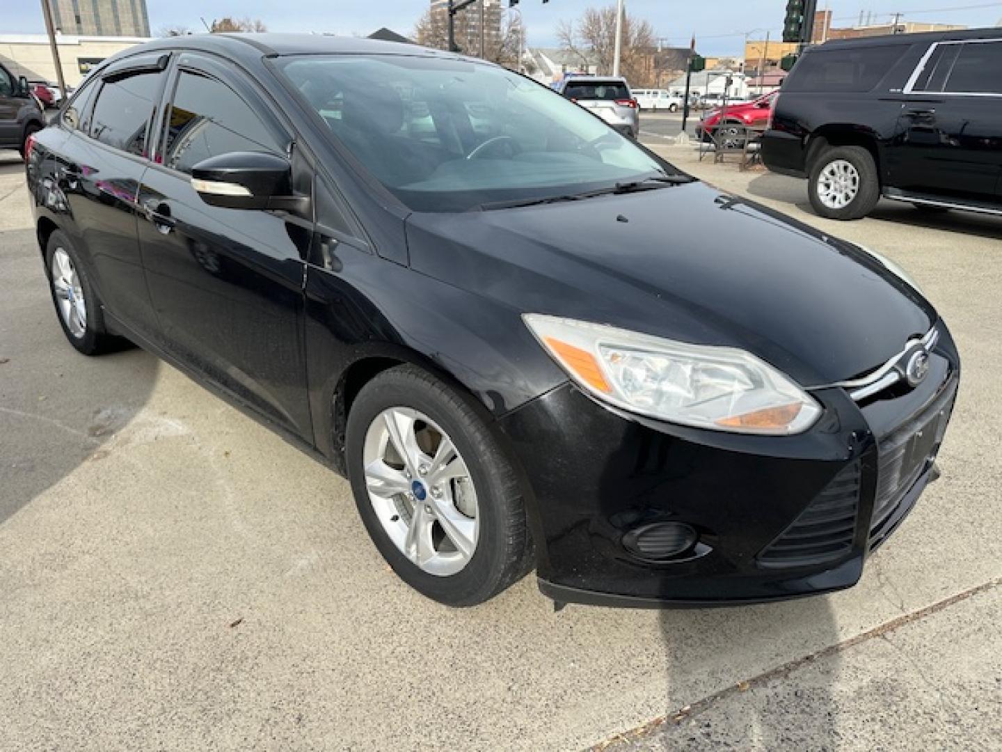 2013 Black /Gray Ford Focus SE Sedan (1FADP3F23DL) with an 2.0L L4 DOHC 16V engine, located at 3200 1st Avenue North, Billings, MT, 59101, (406) 245-9055, 45.779270, -108.510742 - Very nice Local Trade-In with Good Mileage and Great Price! Power Windows, Power Door Locks, Keyless Remote Entry, Air Conditioning, Tilt Steering Column, Cruise Speed Control, Automatic Transmission, Alloy Wheels and More. CarFax Dealer. Auto Brokers of Montana/AA&A Auto Rental/Fox Car Rental B - Photo#4