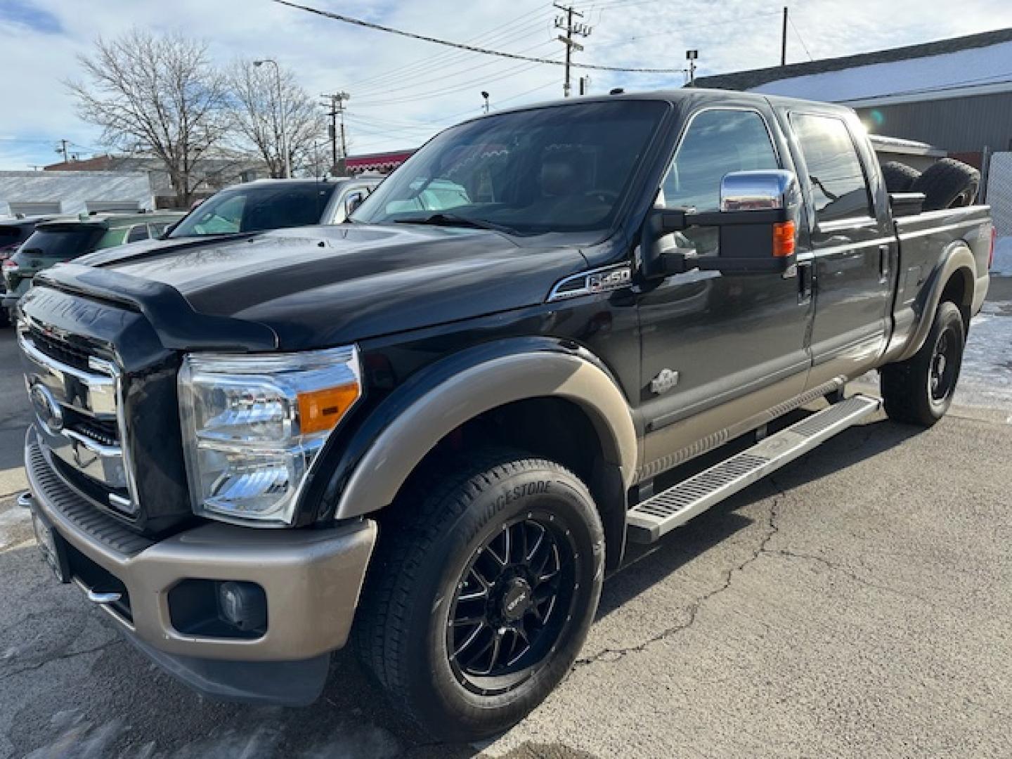 2014 Black /King Ranch Custom Interior Ford F-350 SD King Ranch Crew Cab 4WD (1FT8W3BT1EE) with an 6.7L V8 OHV 16V DIESEL engine, 6-Speed Automatic transmission, located at 3200 1st Avenue North, Billings, MT, 59101, (406) 245-9055, 45.779270, -108.510742 - Super Sharp Ford F350 Super Duty Crew Cab. Local Trade-In, Low Mileage, 6.7-16 Valve Diesel Power, Dual Power Seats, Power Windows, Power Door Locks, Automatic Transmission, Tow Package, Bed Liner, Running Boards, Recessible Ball Hitch, Lockable Tailgate, Blizzak Tires, Extra Set of Wheels & Tires f - Photo#1